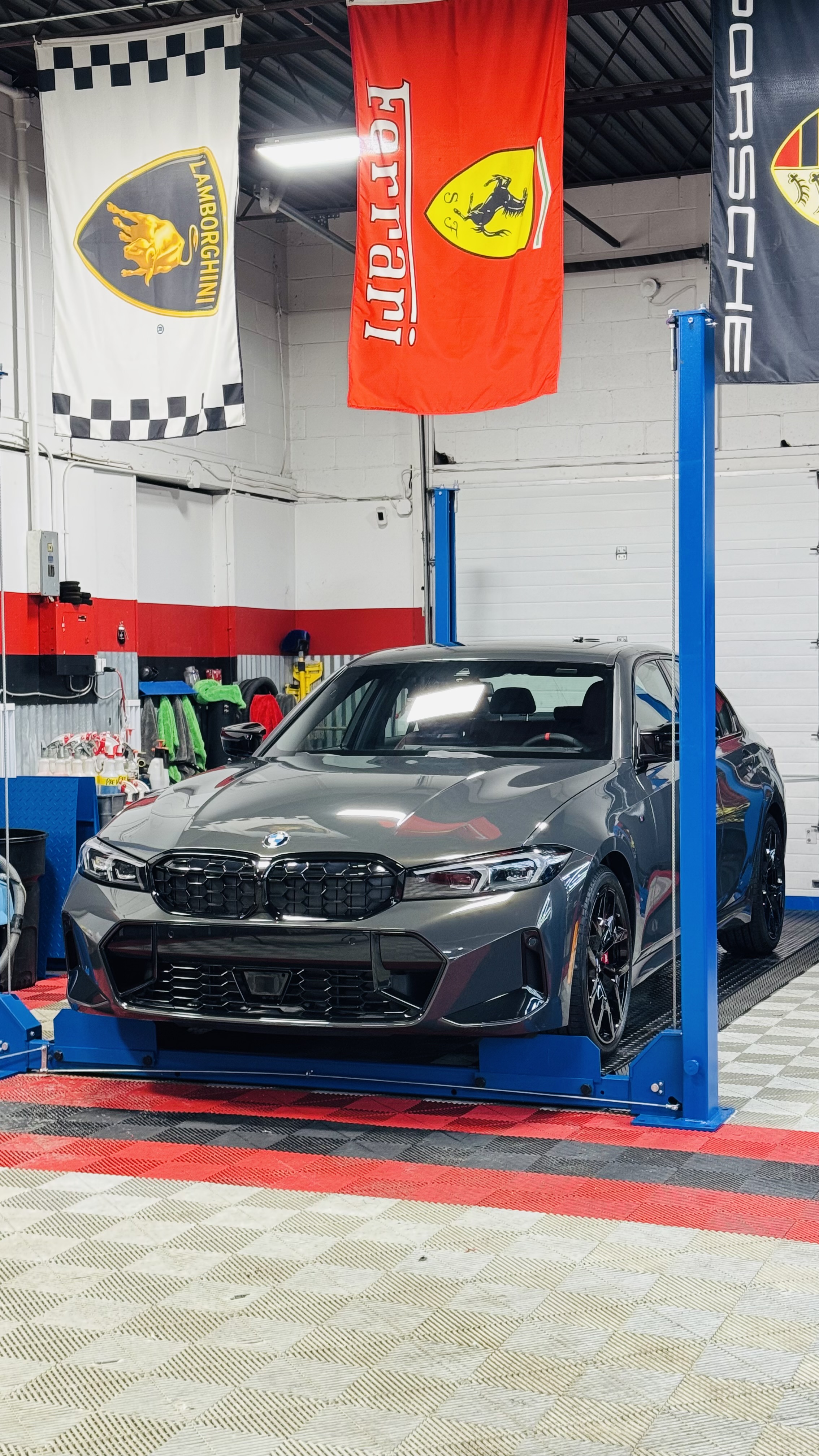 Gray BMW M3 on lift at Detail Masters