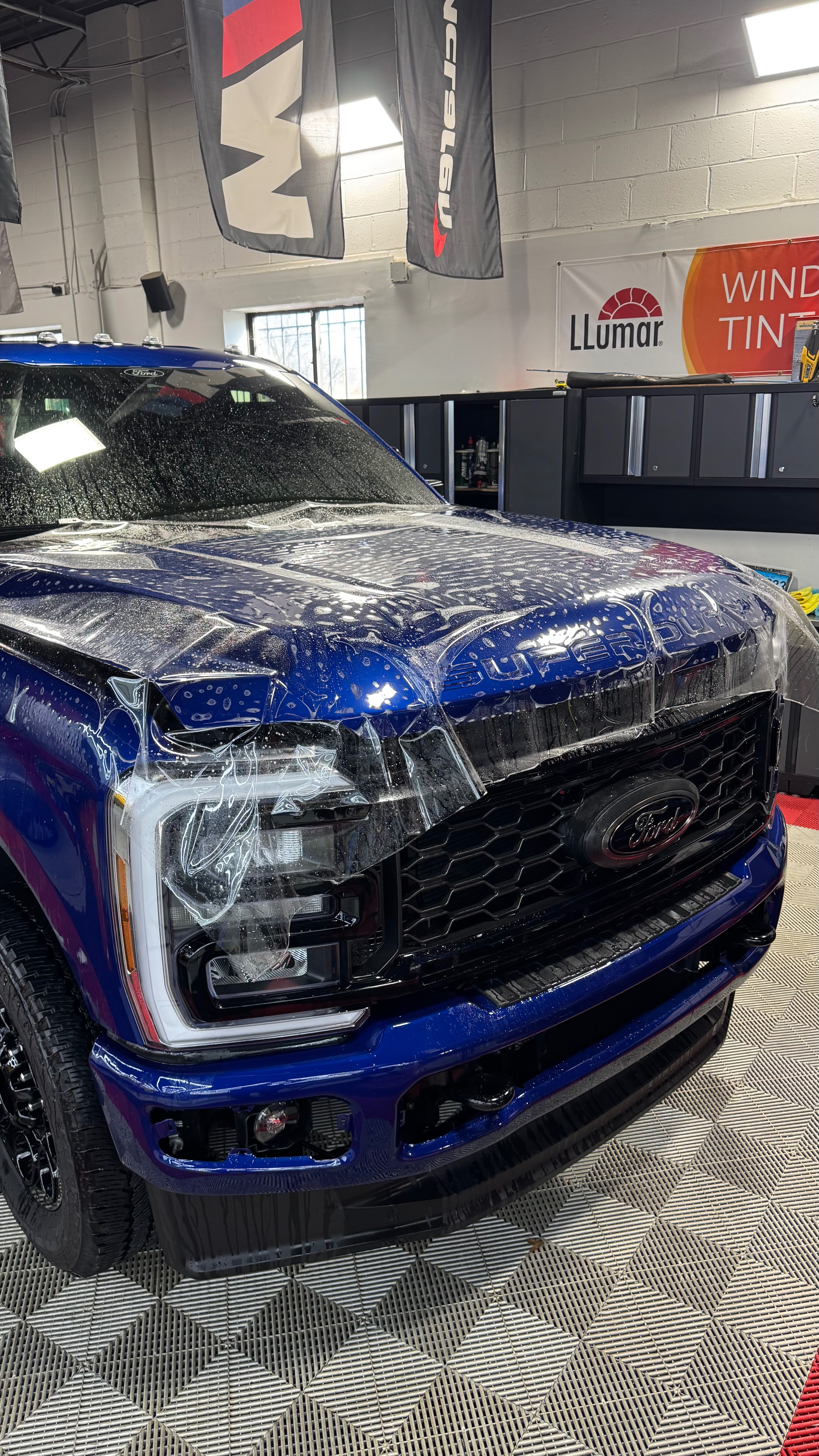 Blue Ford Super Duty getting PPF installation